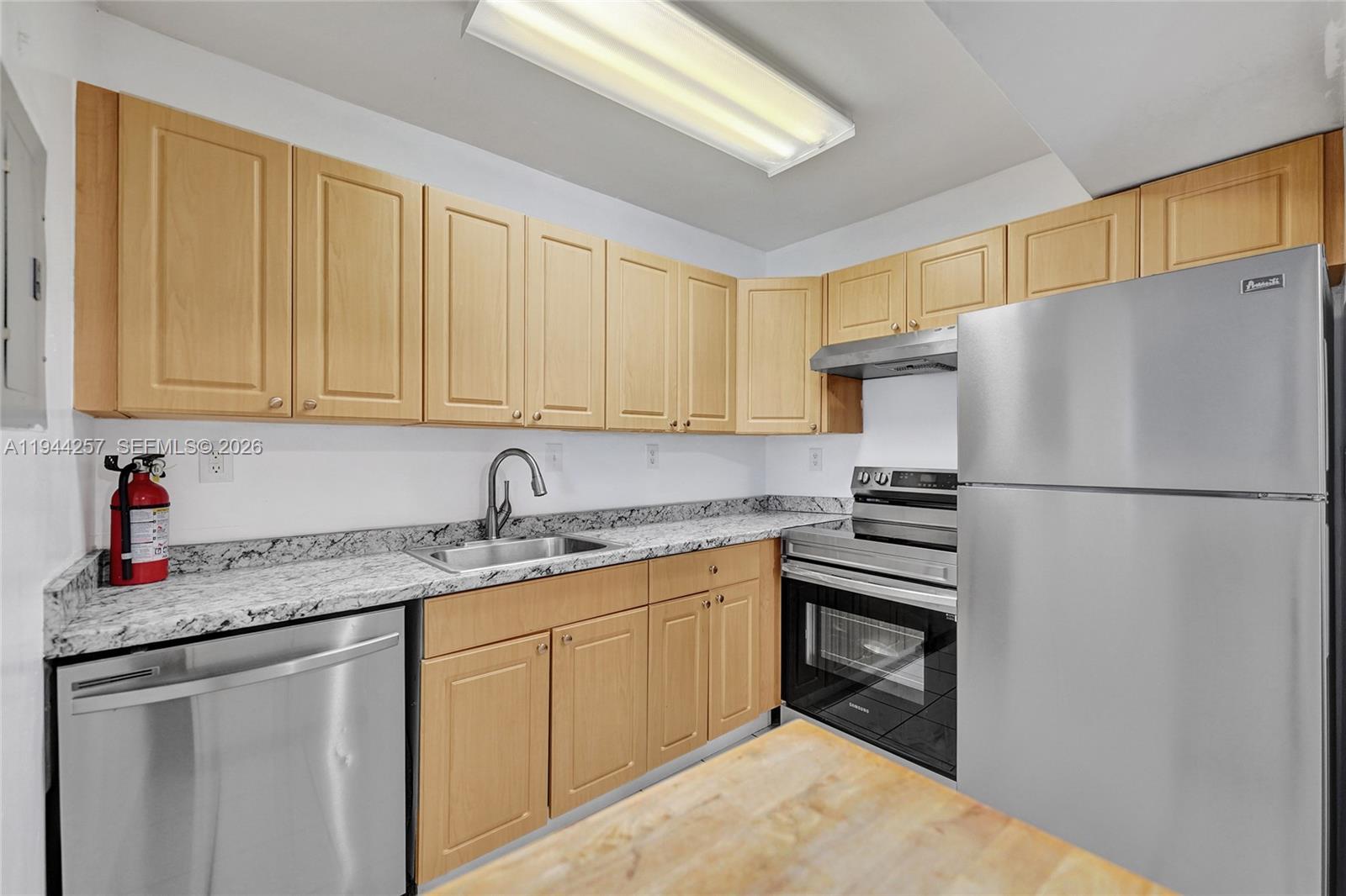 505 South Pine Island Road, Unit 405B Plantation, FL 33324 - Photo 14 of 43 a kitchen with stainless steel appliances granite countertop a refrigerator sink and stove