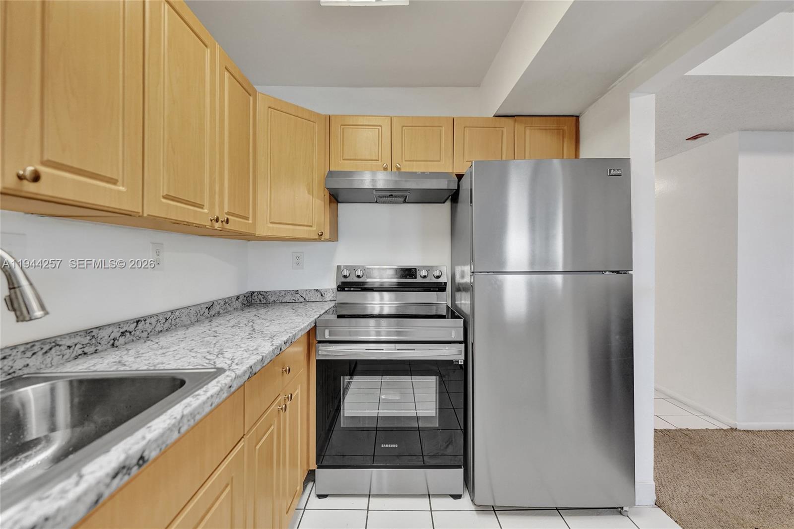 505 South Pine Island Road, Unit 405B Plantation, FL 33324 - Photo 15 of 43 a kitchen with appliances cabinets and a counter top space