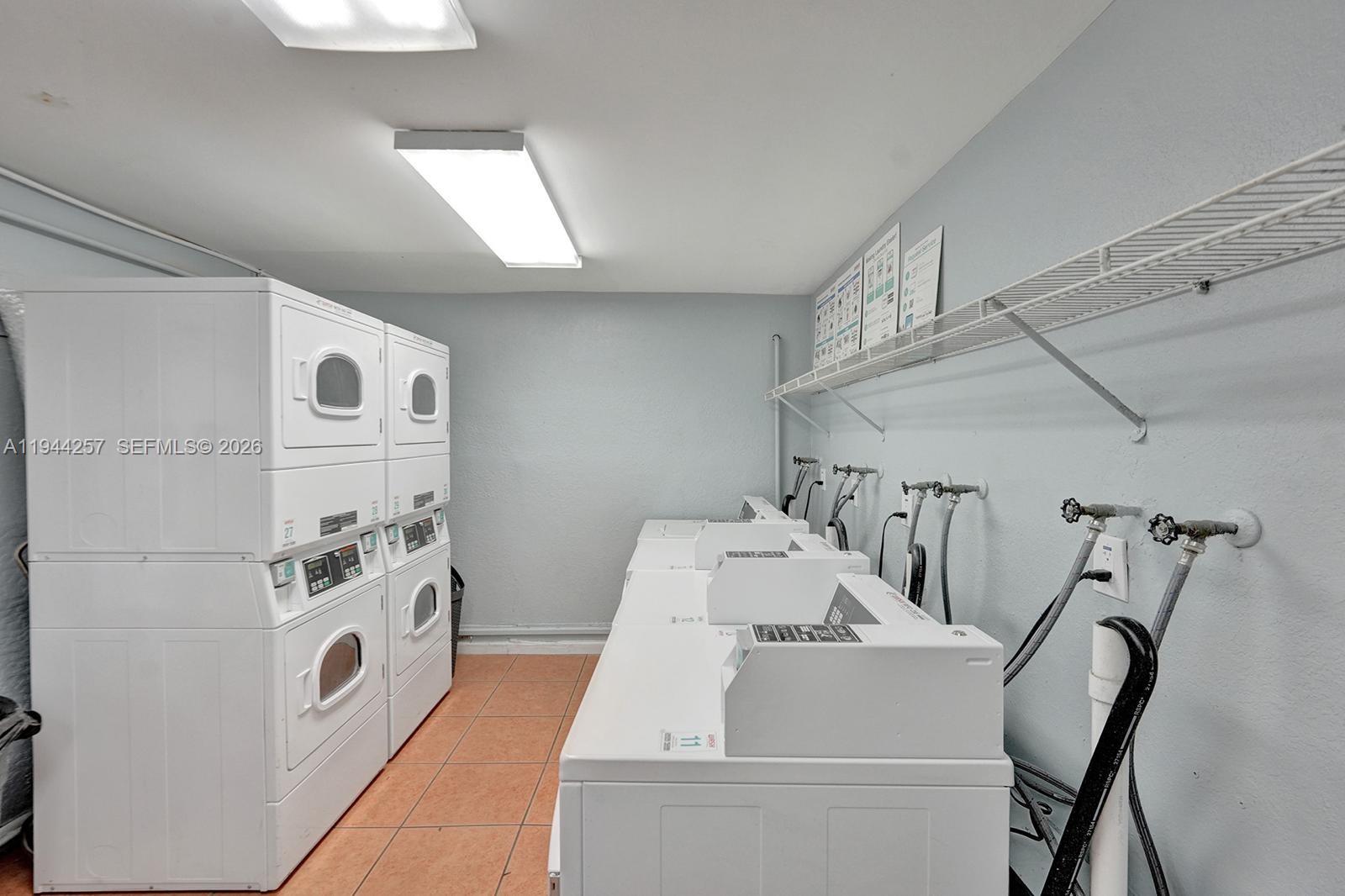 505 South Pine Island Road, Unit 405B Plantation, FL 33324 - Photo 28 of 43 a bathroom with a sink a mirror and a shower