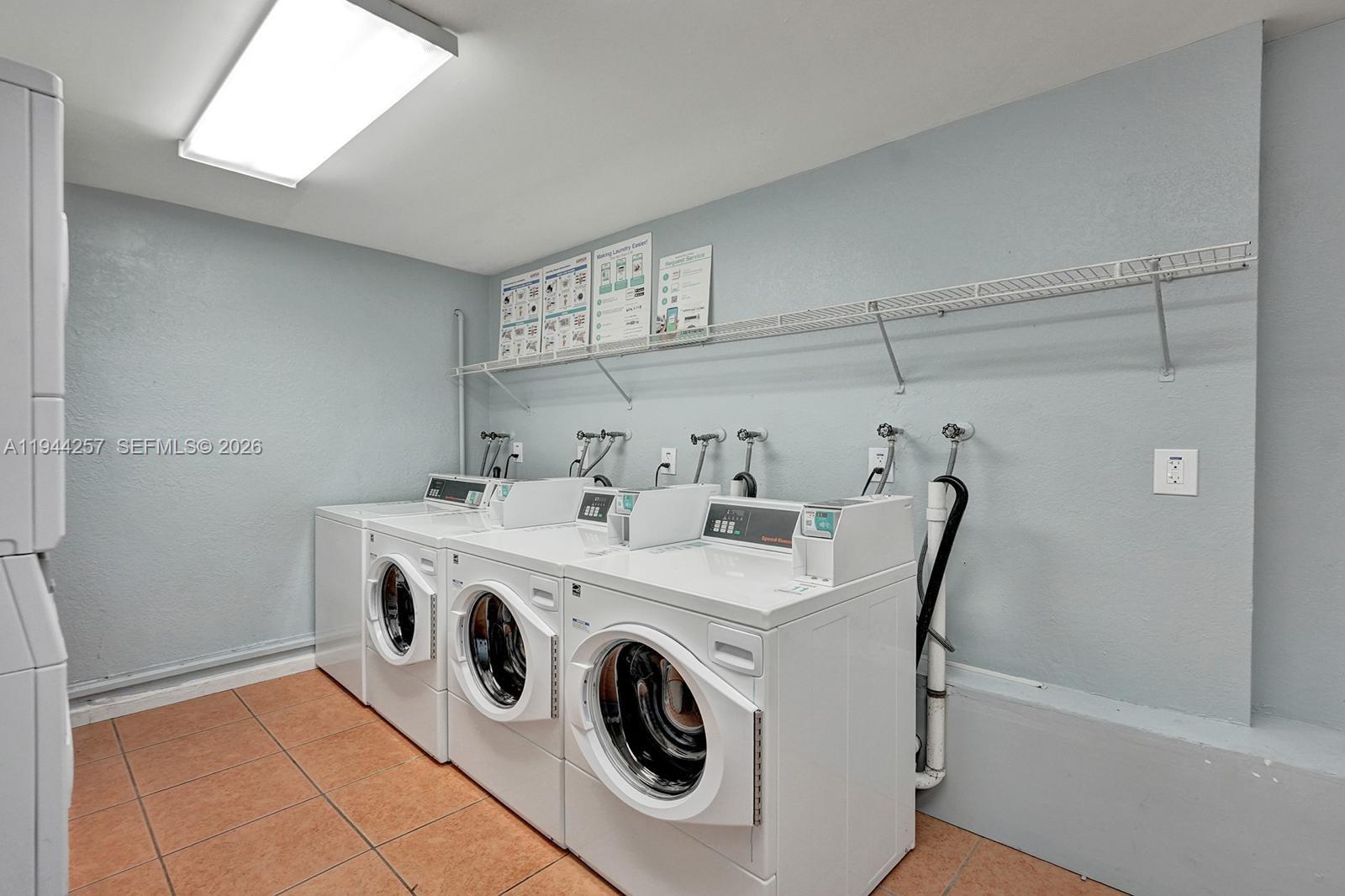 505 South Pine Island Road, Unit 405B Plantation, FL 33324 - Photo 29 of 43 a utility room with dryer and washer