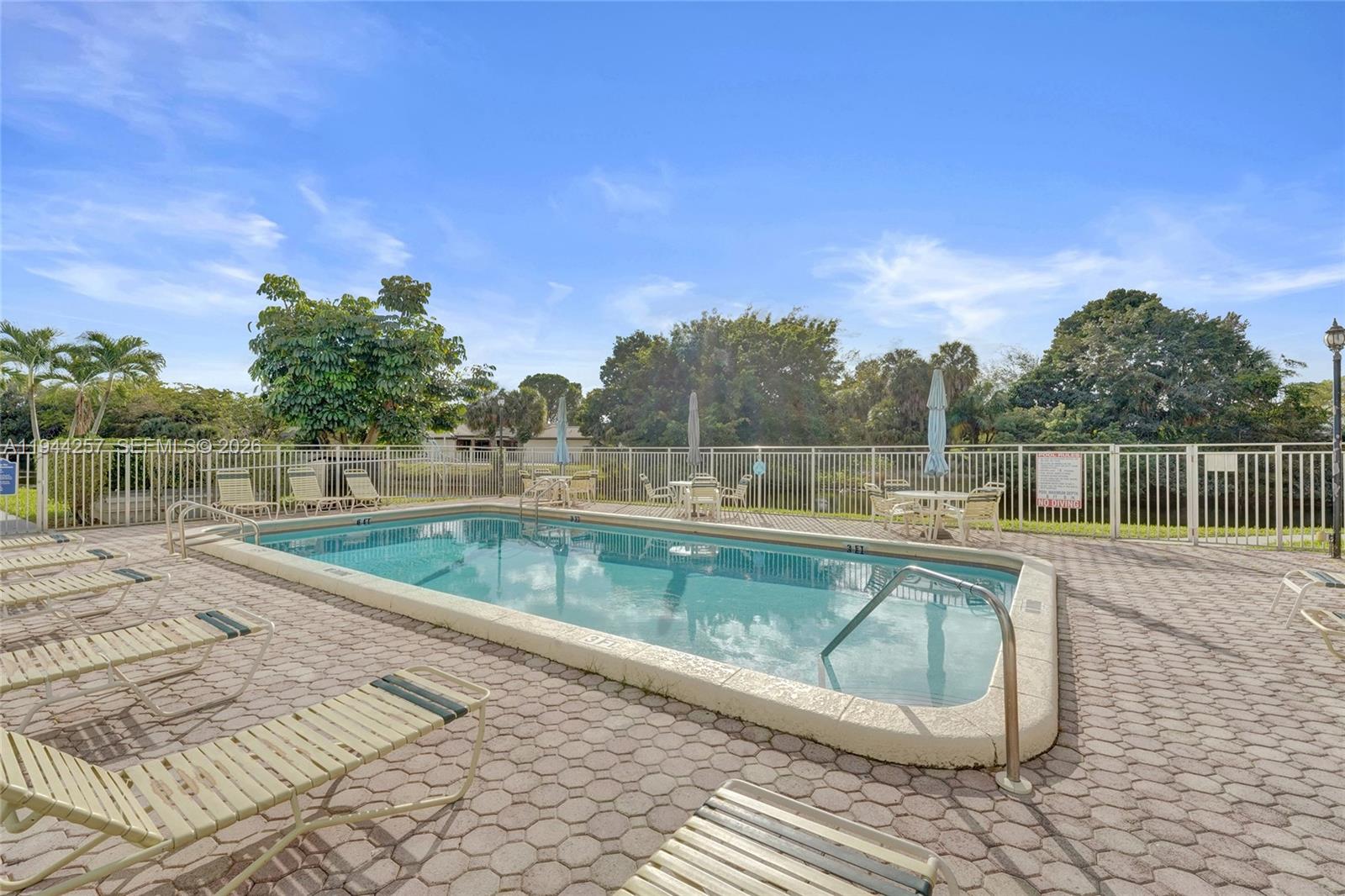 505 South Pine Island Road, Unit 405B Plantation, FL 33324 - Photo 34 of 43 a view of a swimming pool with a lake view