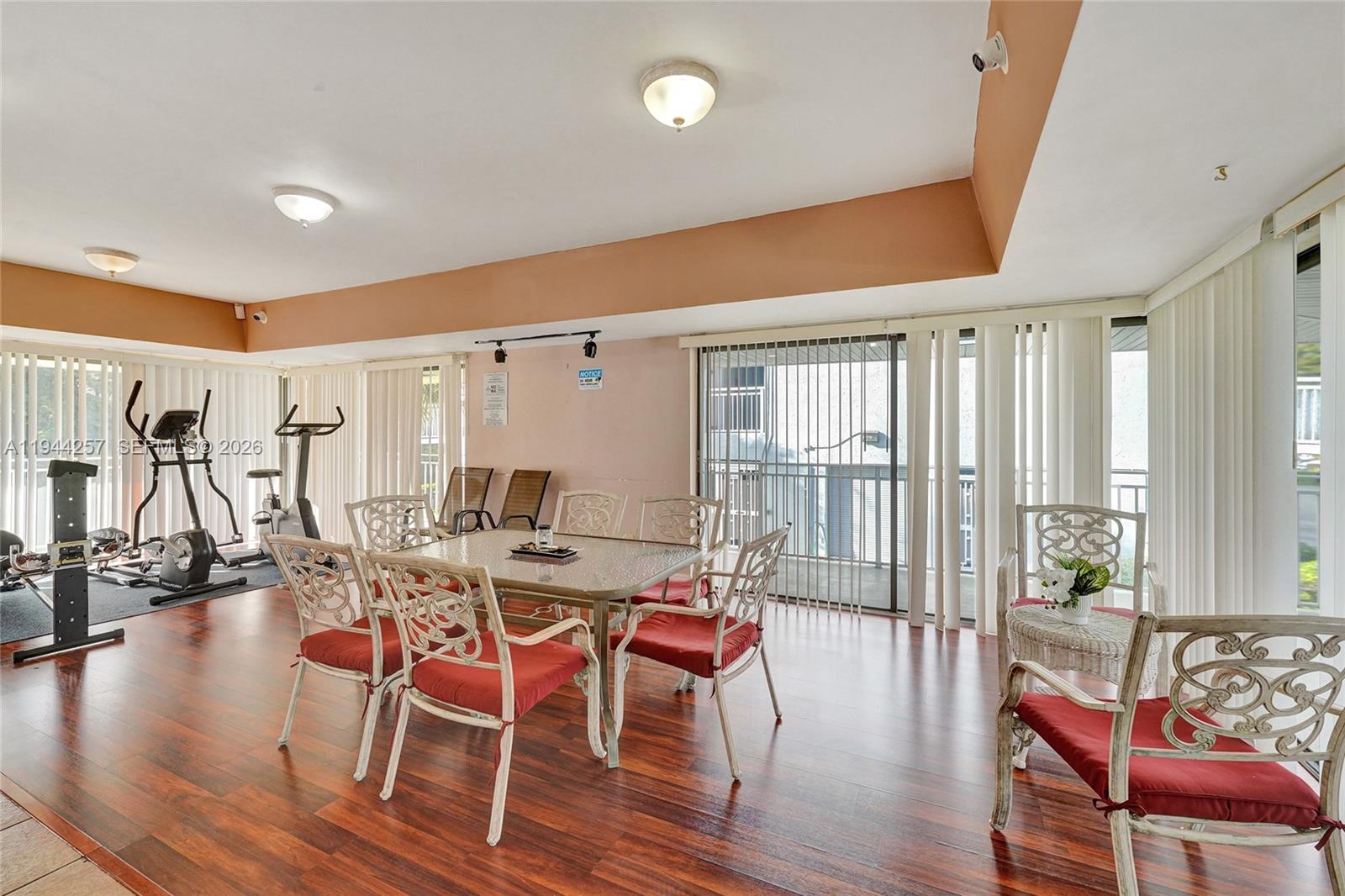 505 South Pine Island Road, Unit 405B Plantation, FL 33324 - Photo 37 of 43 a view of a dining room with furniture and wooden floor