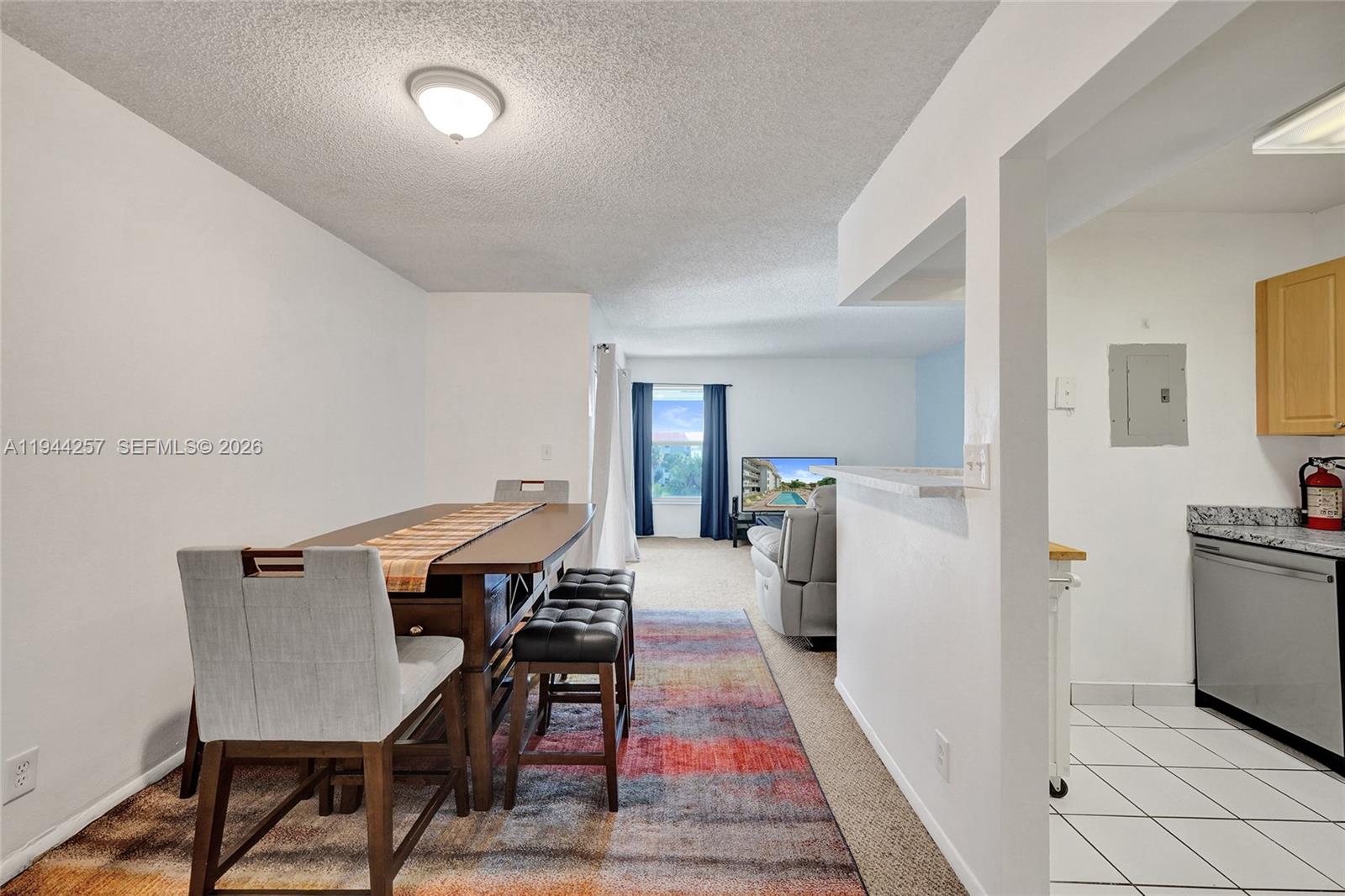 505 South Pine Island Road, Unit 405B Plantation, FL 33324 - Photo 10 of 43 a view of a dining room with furniture
