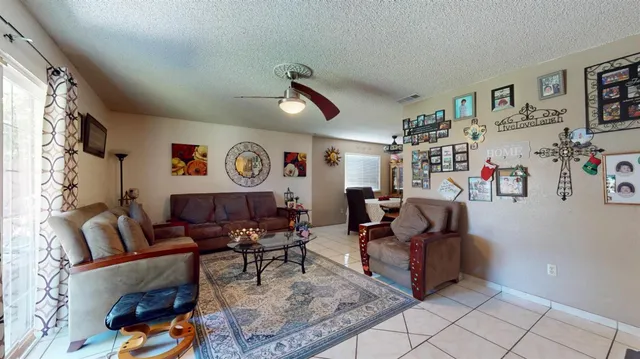 a living room with furniture and a rug