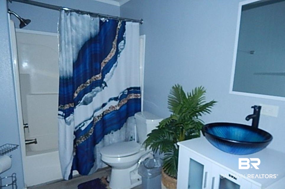 6996 Pinehill Road Daphne, AL 36526 - Photo 18 of 18 Bathroom with vanity and shower / bath combo
