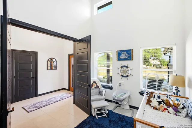 a bedroom with furniture and a window