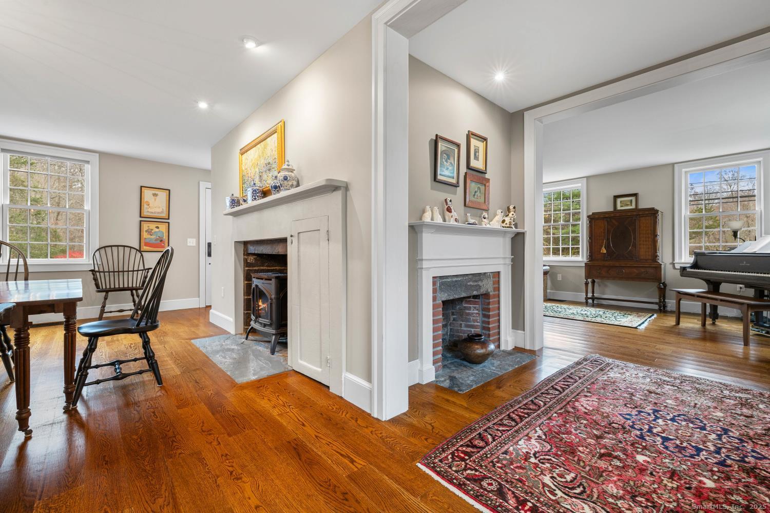 138 School House Road Old Saybrook, CT 06475 - Photo 11 of 40 a living room with furniture and a fireplace