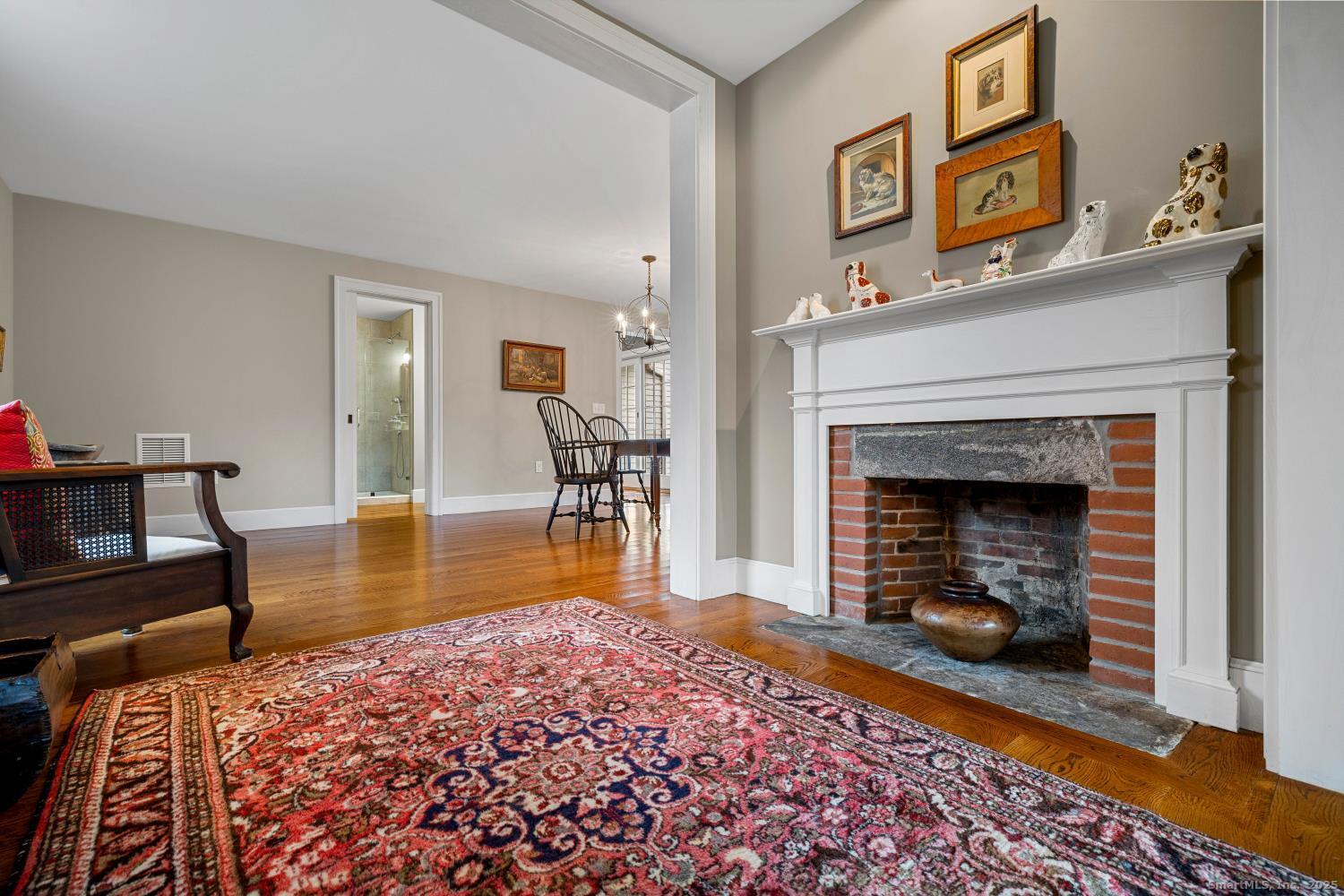 138 School House Road Old Saybrook, CT 06475 - Photo 13 of 40 a living room with furniture and a fireplace