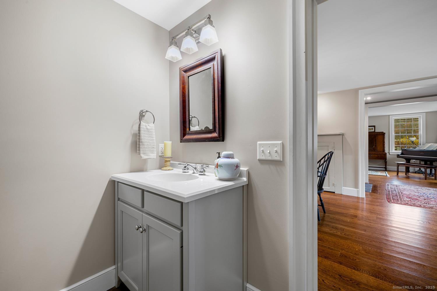 138 School House Road Old Saybrook, CT 06475 - Photo 18 of 40 a bathroom with a sink a vanity and a mirror