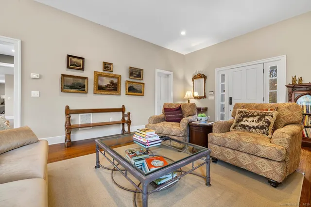 a living room with furniture and a table