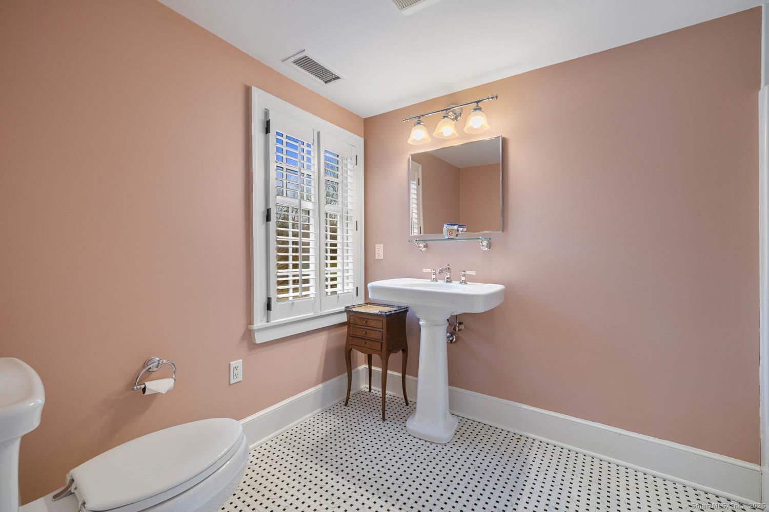 138 School House Road Old Saybrook, CT 06475 - Photo 37 of 40 a bathroom with a sink a toilet and a mirror