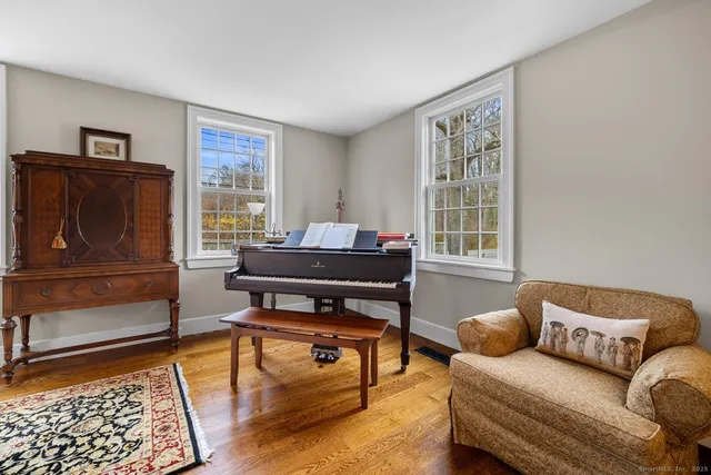 a living room with furniture and a window