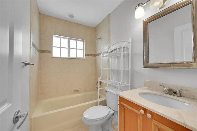 a view of backyard with potted plants and palm trees