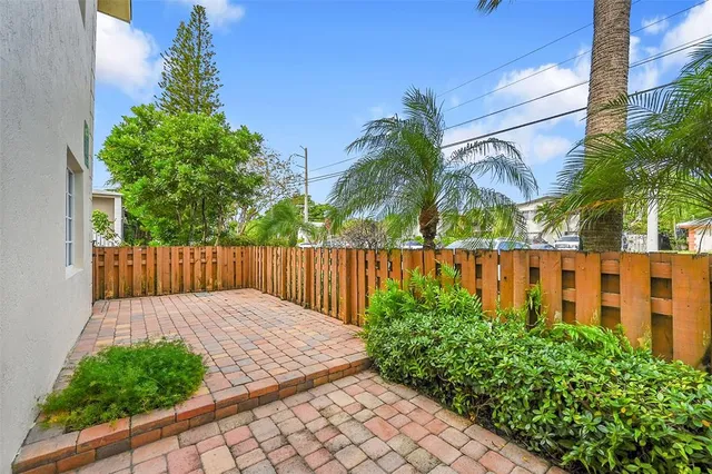 a view of swimming pool with outdoor seating and plants