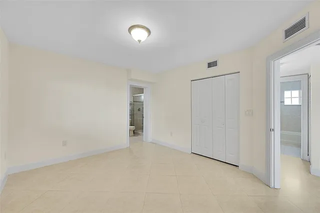 an empty room with closet area