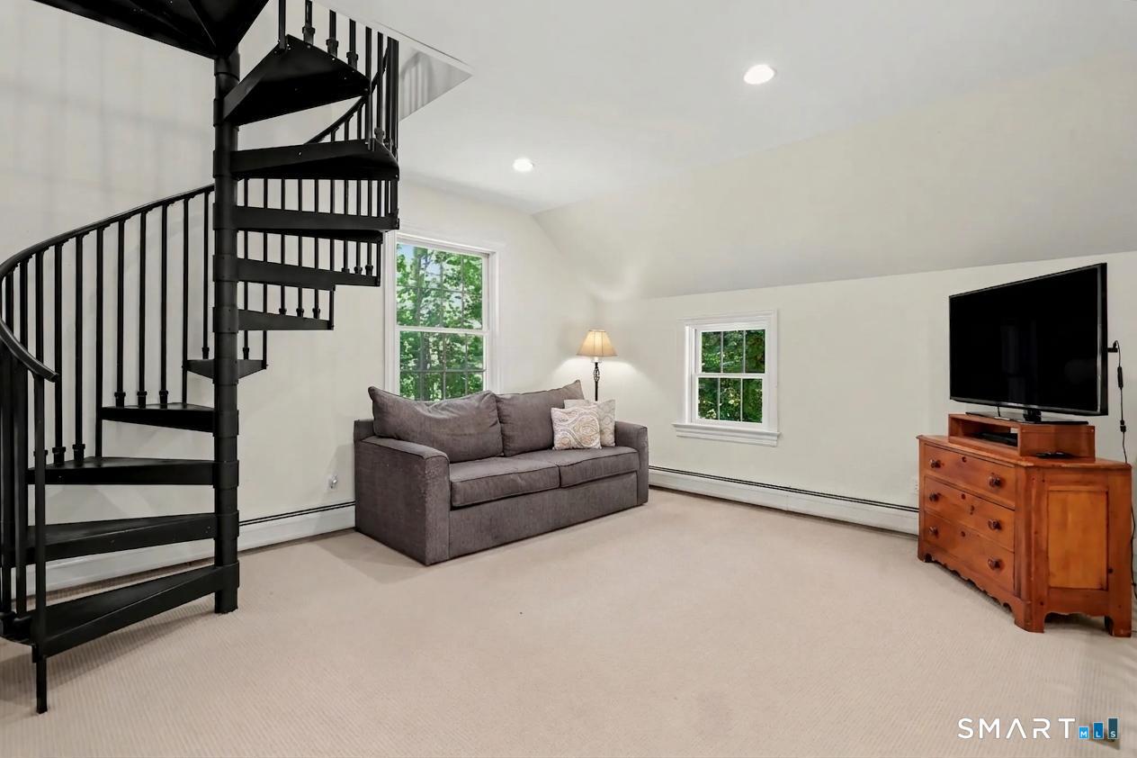 31 Vista Road Wilton, CT 06897 - Photo 22 of 34 Versatile and inviting, this second-floor den provides flexible living space ideal for relaxing, working, or watching tv.