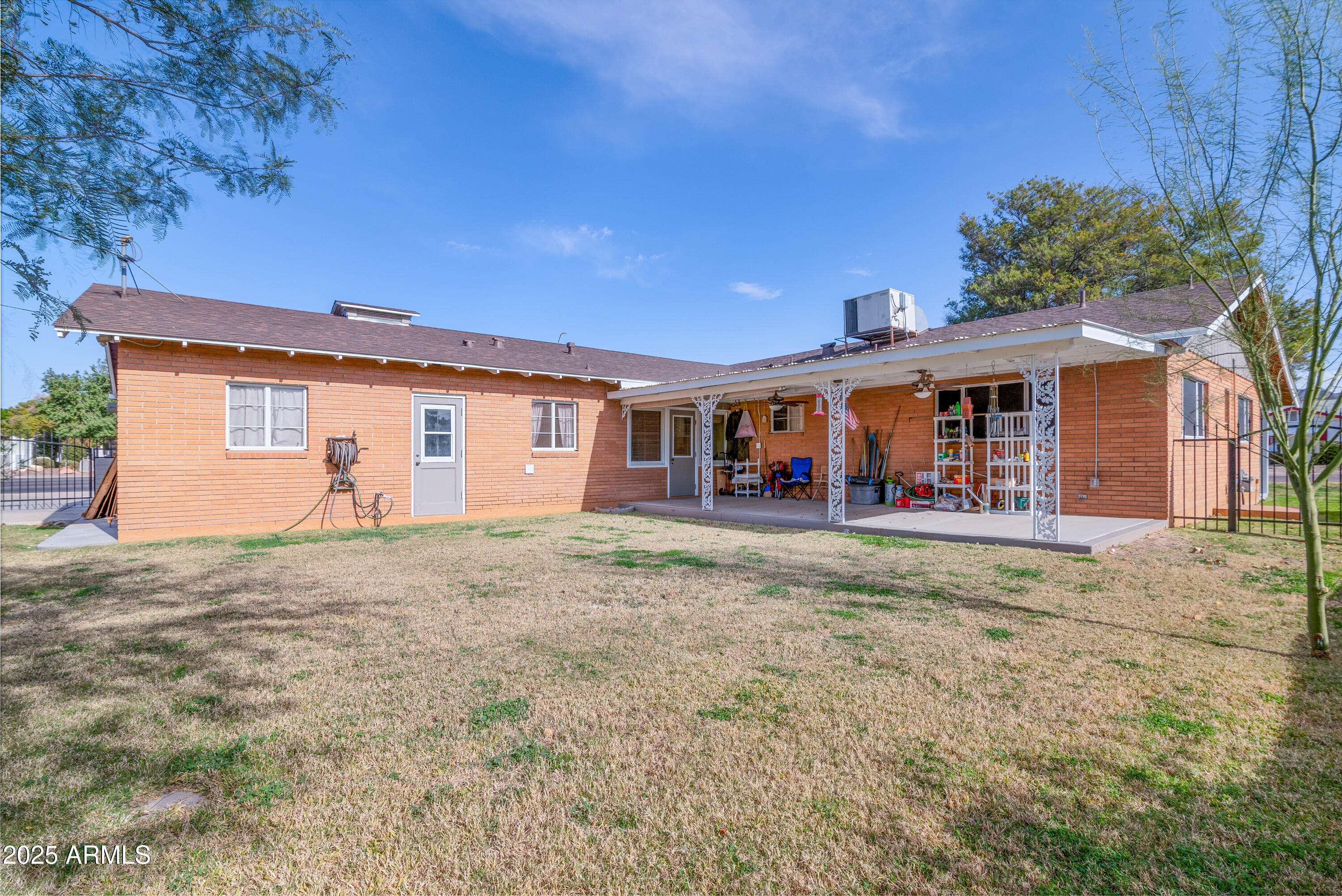 6850 North 15th Place Phoenix, AZ 85014 - Photo 23 of 26 a view of a house with a backyard