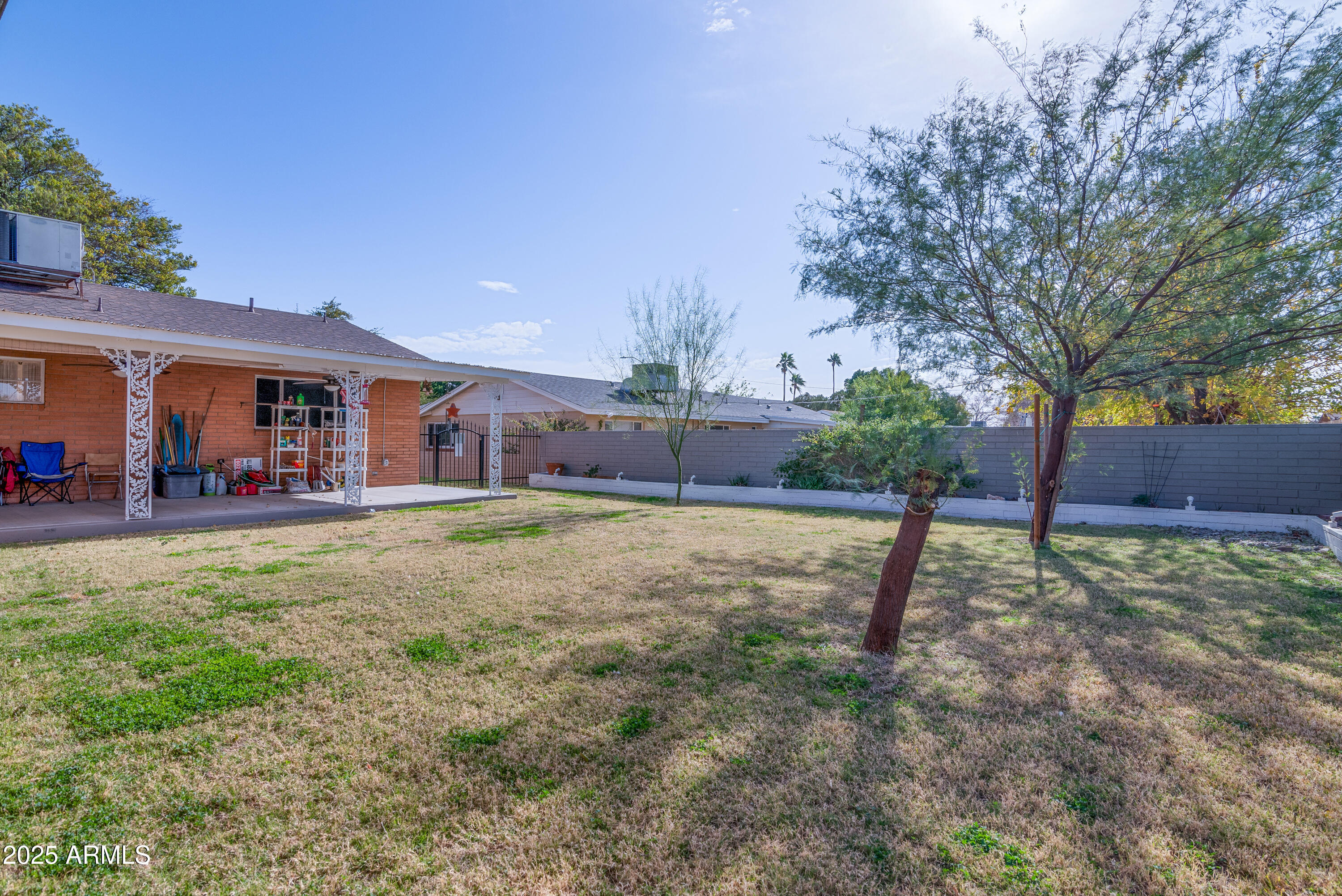 6850 North 15th Place Phoenix, AZ 85014 - Photo 24 of 26 a view of a yard with a slide