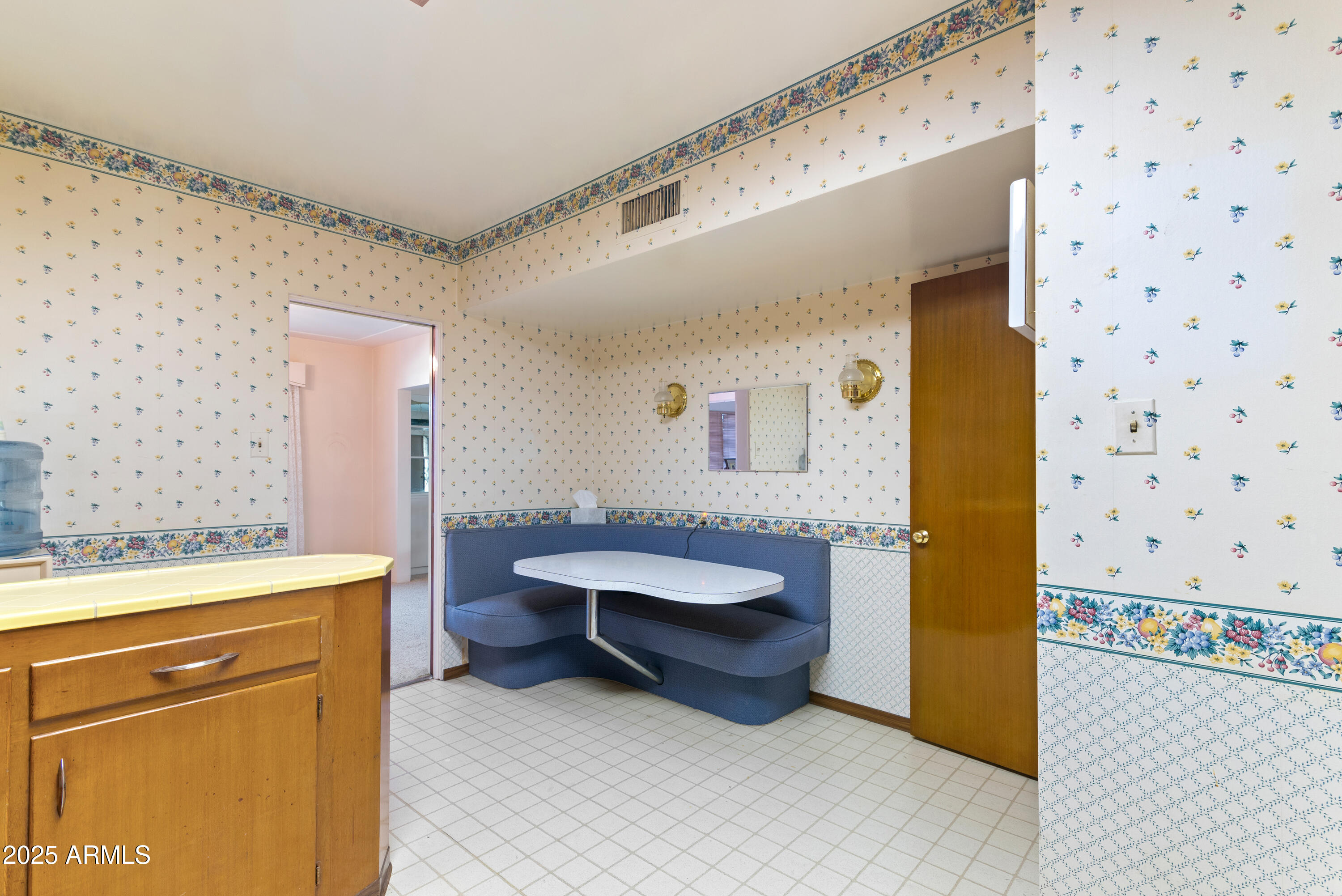 6850 North 15th Place Phoenix, AZ 85014 - Photo 10 of 26 a bathroom with a sink a toilet and a shower curtain