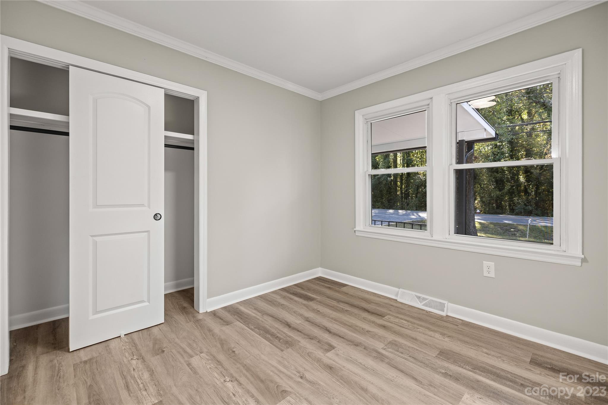 1415 East Main Street Cherryville, NC 28021 - Photo 15 of 34 a view of empty room with wooden floor and fan