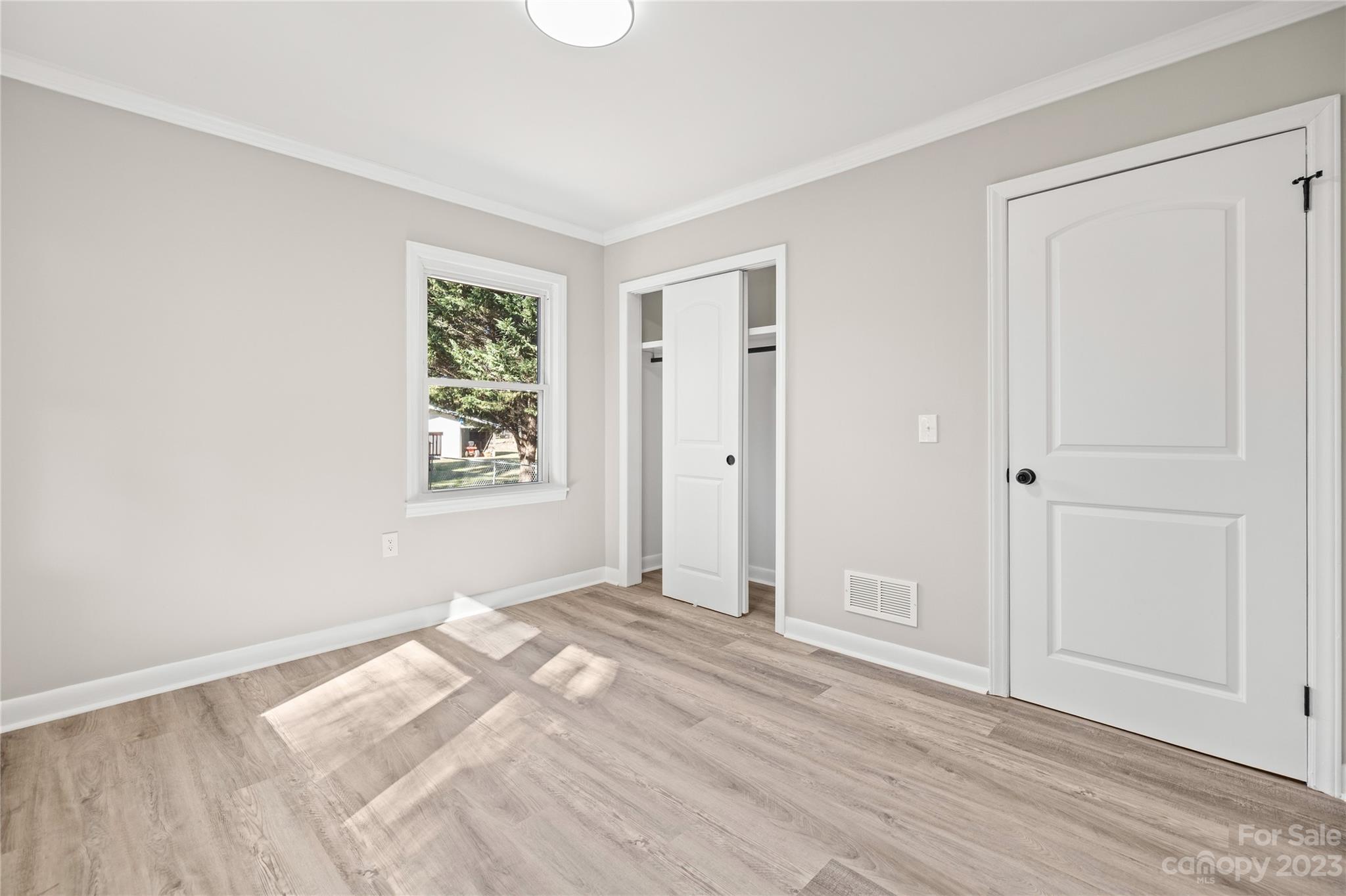 1415 East Main Street Cherryville, NC 28021 - Photo 17 of 34 a view of room with window and hardwood floor