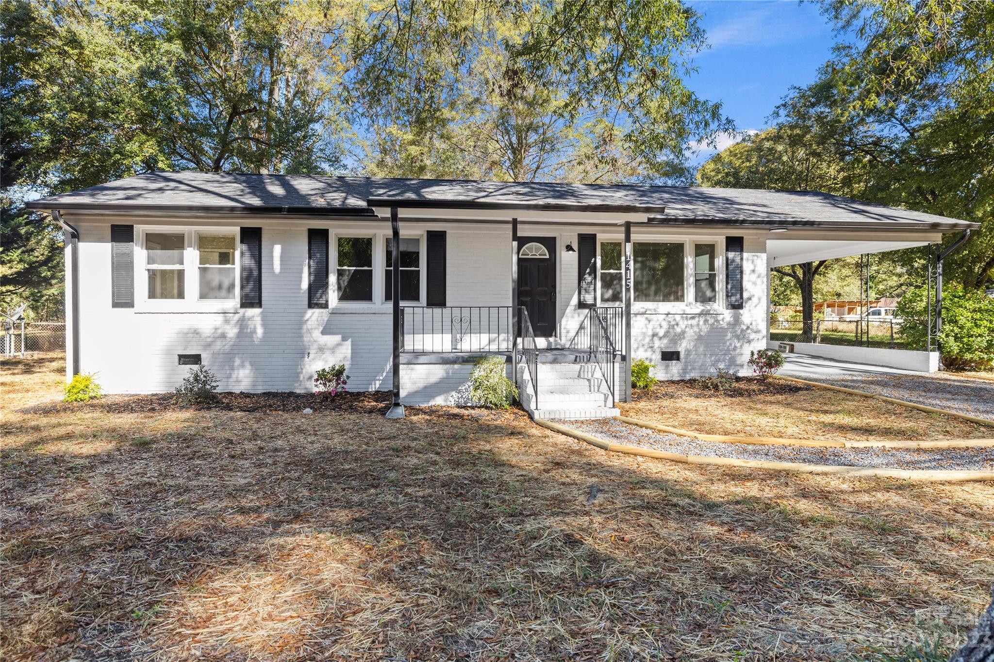 1415 East Main Street Cherryville, NC 28021 - Photo 23 of 34 a front view of a house with a yard patio