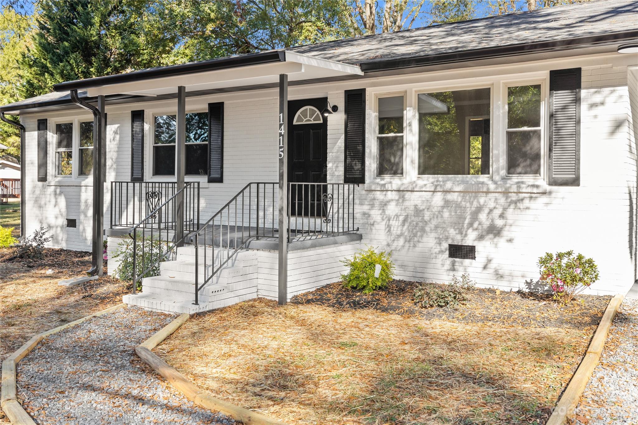 1415 East Main Street Cherryville, NC 28021 - Photo 26 of 34 a view of a house with a backyard
