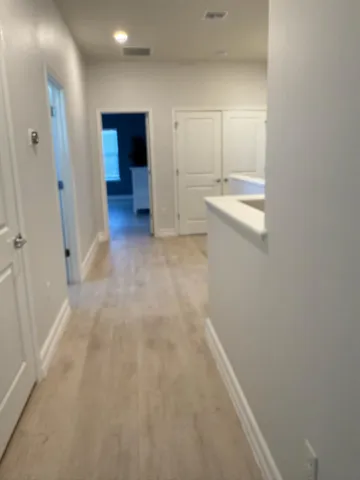 a view of entryway with a wooden fence