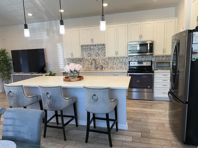 a view of a dining room with furniture and wooden floor