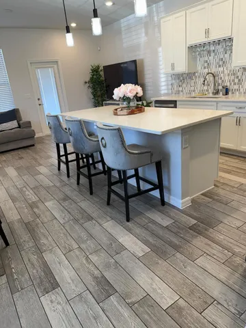 a view of a porch with wooden fence