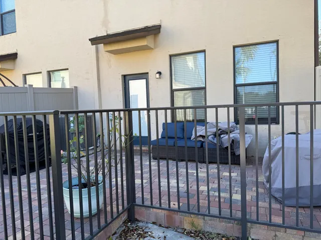 a view of a balcony with wooden floor