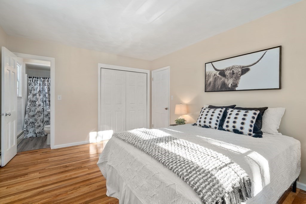 3 Silverbrook Road Boxford, MA 01921 - Photo 24 of 39 a bedroom with a large bed and a wooden floor