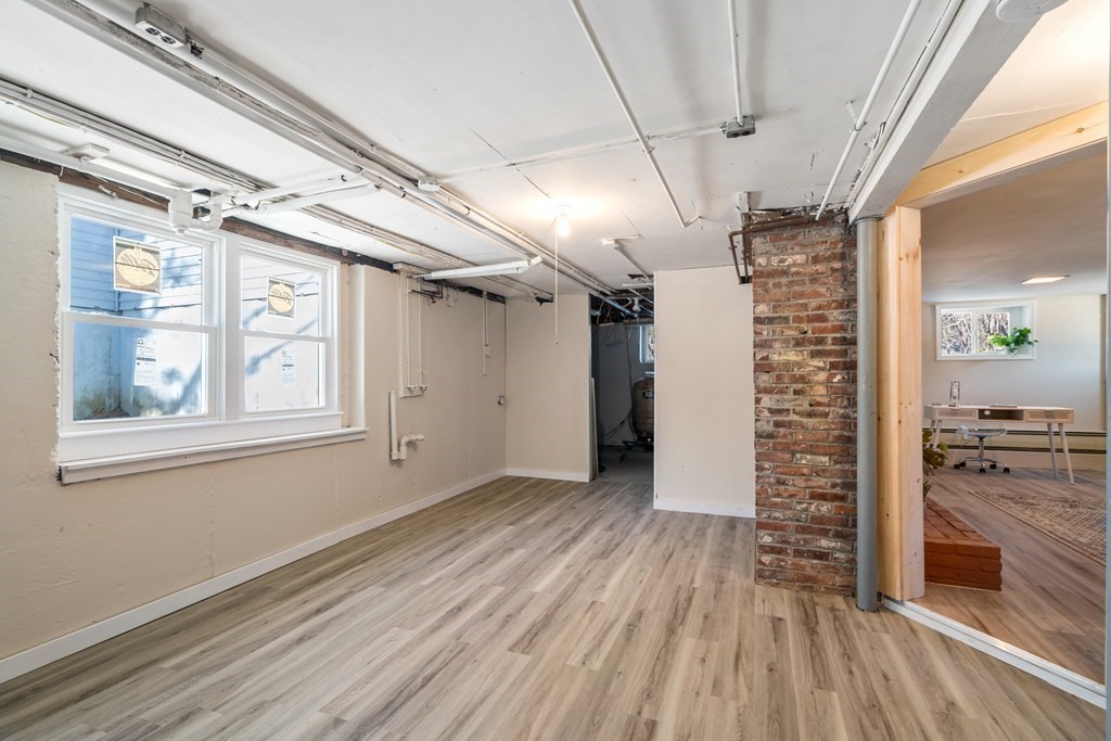 3 Silverbrook Road Boxford, MA 01921 - Photo 33 of 39 a view of empty room with wooden floor and fireplace