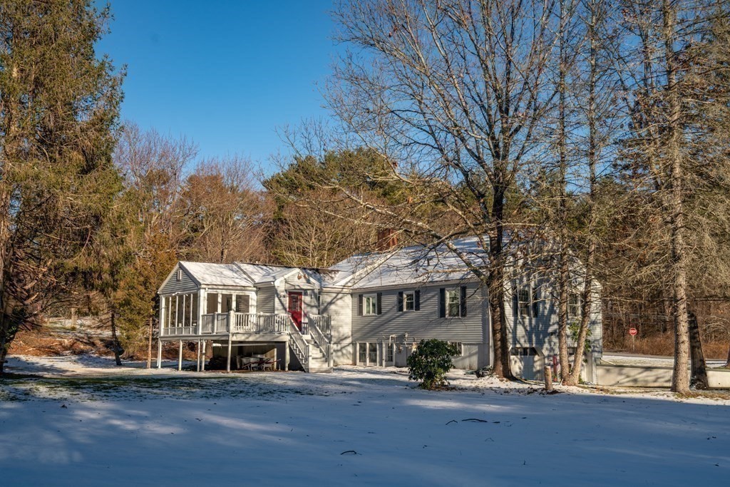 3 Silverbrook Road Boxford, MA 01921 - Photo 34 of 39 a front view of a building with large trees and plants