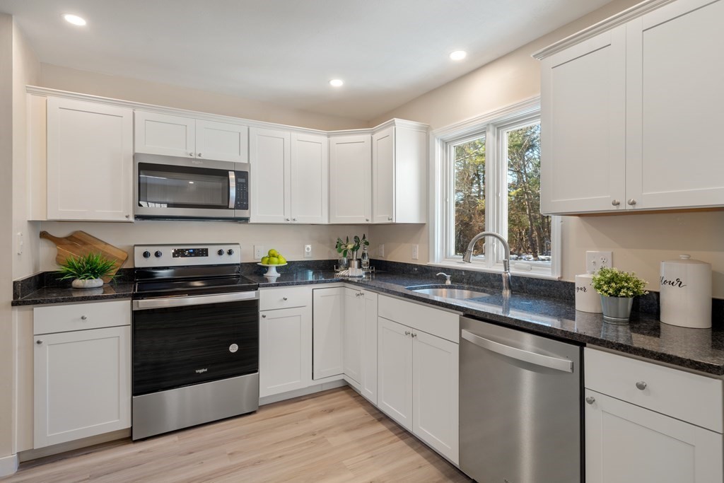 3 Silverbrook Road Boxford, MA 01921 - Photo 7 of 39 a kitchen with stainless steel appliances granite countertop a stove a sink a microwave a refrigerator and cabinets