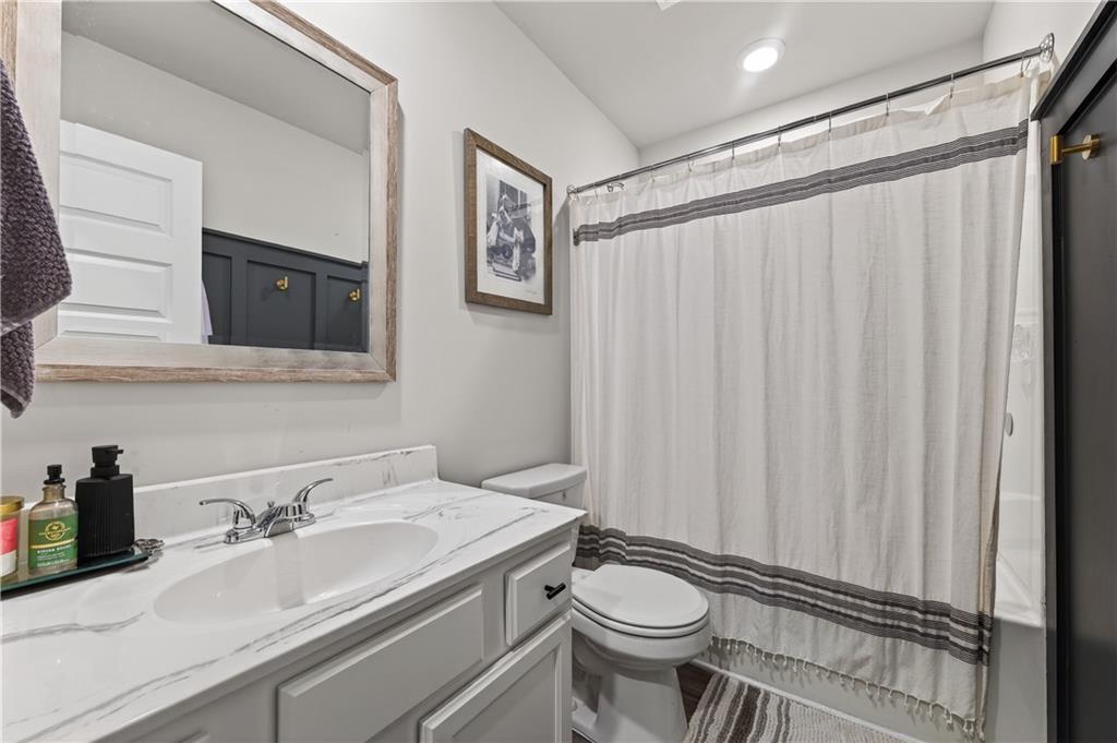 266 Shoals Bridge Road Acworth, GA 30102 - Photo 33 of 43 a bathroom with a granite countertop sink and a mirror