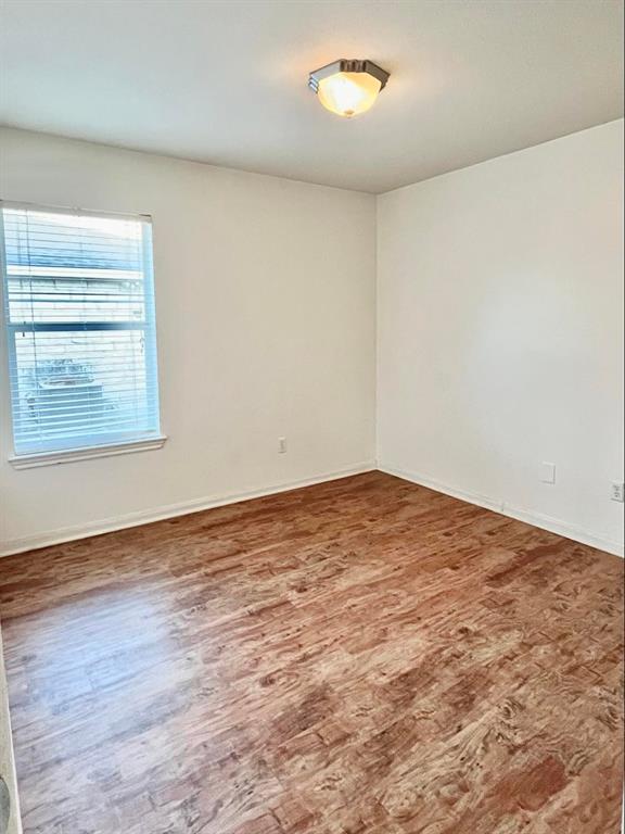 2409 Romeo Drive Cedar Park, TX 78613 - Photo 15 of 22 an empty room with wooden floor and windows