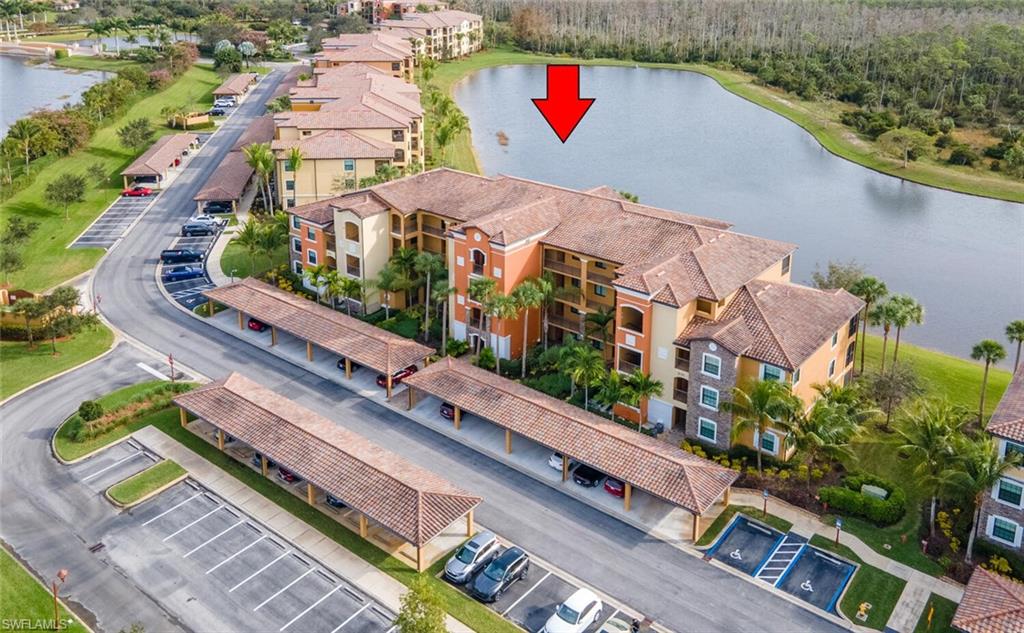 9731 Acqua Court, Unit 536 Naples, FL 34113 - Photo 3 of 47 an aerial view of residential houses with outdoor space
