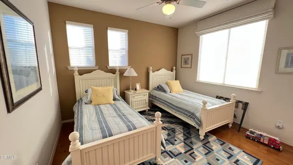 a bedroom with furniture and a window