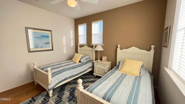 a bedroom with furniture and a window