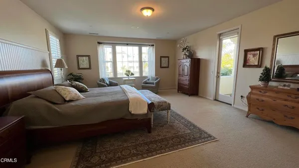 a bed room with a bed and a television