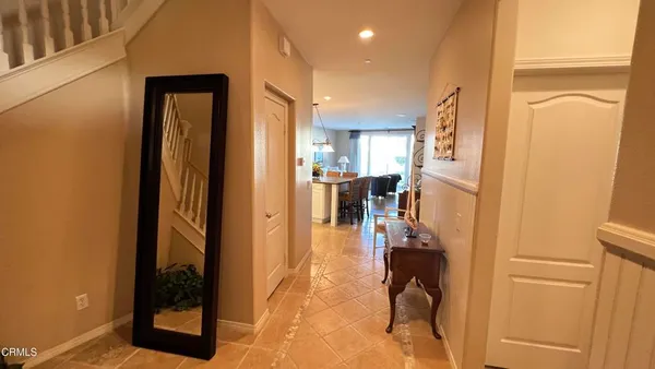 a view of a hallway with living room and furniture