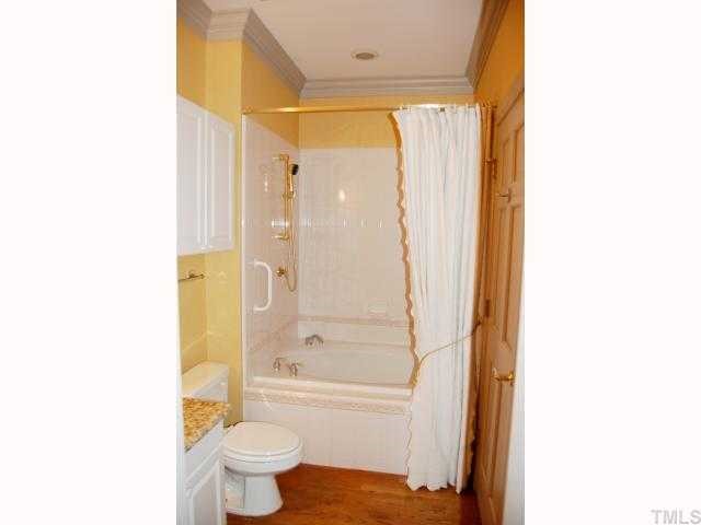 1505 Ridge Road Raleigh, NC 27607 - Photo 8 of 11 a bathroom with a shower and a toilet