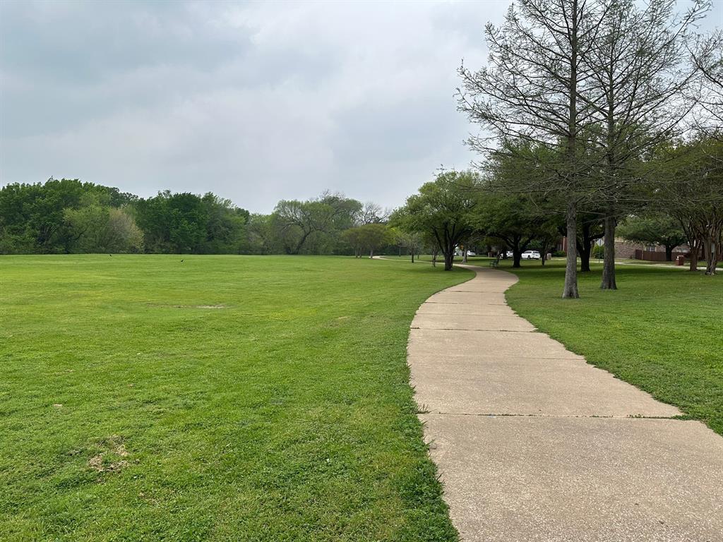 3101 Buckthorn Street Forney, TX 75126 - Photo 36 of 40 Expansive green space featuring a winding concrete pathway
