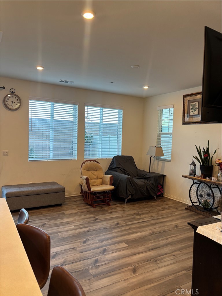 533 Pablo Road Lake Elsinore, CA 92530 - Photo 5 of 21 a living room with furniture a flat screen tv and a large window