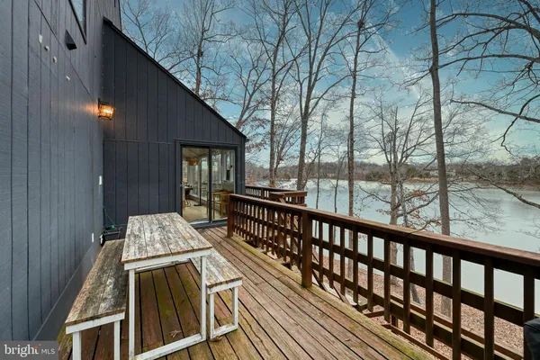 a view of outdoor space with wooden floor and seating area