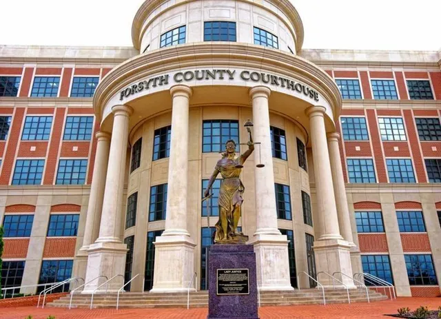 a view of a building with a yard