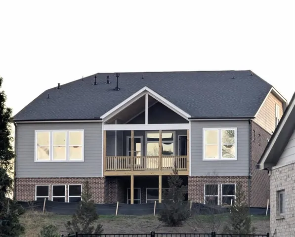 a front view of a house with glass windows