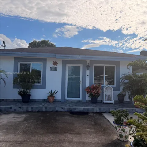 a front view of a house with a sitting area