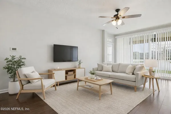 a bathroom with a double vanity sink a mirror and a bathtub